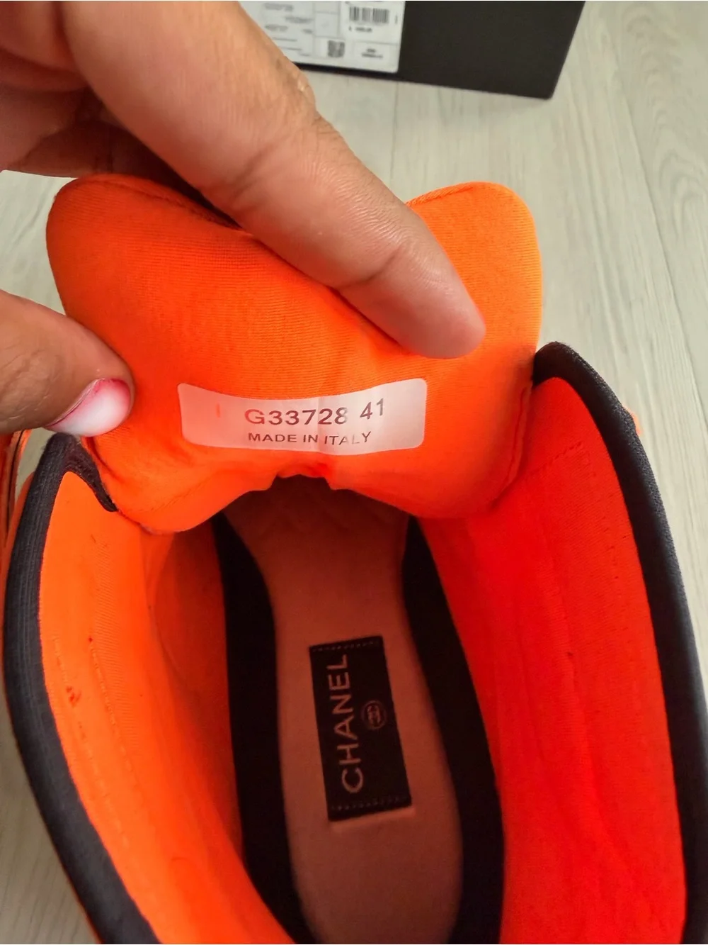 CHANEL Orange and Black High-Top Sneaker